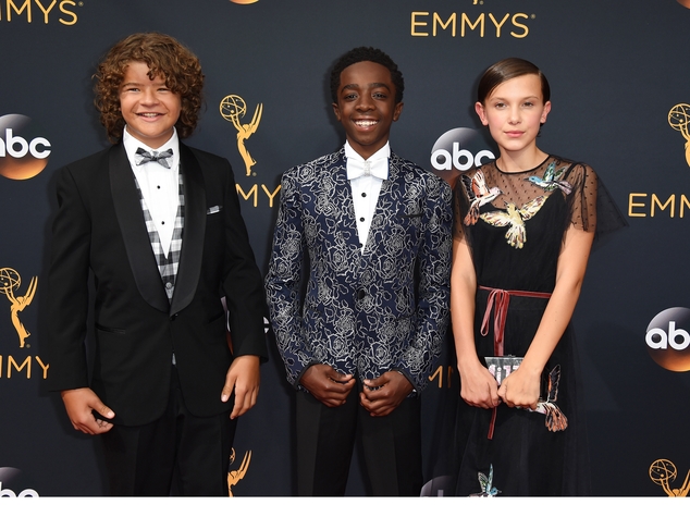 Gaten Matarazzo, from left, Caleb McLaughlin, and Millie Bobby Brown arrive at the 68th Primetime Emmy Awards on Sunday, Sept. 18, 2016, at the Microsoft Theater in Los Angeles. (Photo by Jordan Strauss/Invision/AP)